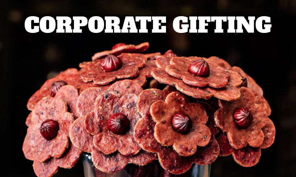 Luxury corporate gifts for executives and clients including personalized whiskey decanter sets, jerky ammo cans, and bacon bouquets—premium, bold gifts for serious professionals.