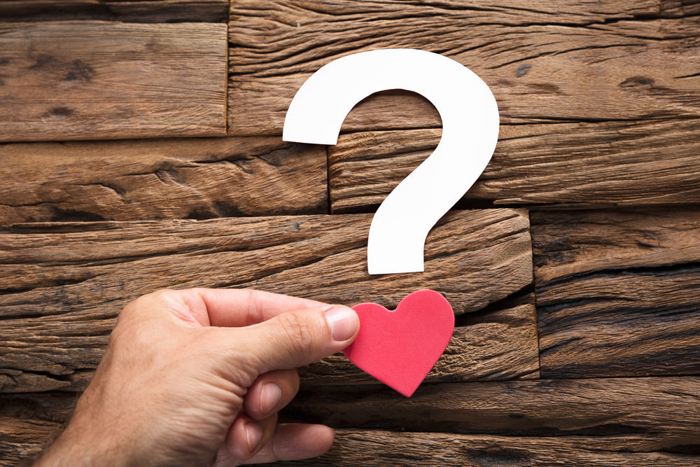 Heart-shaped paper in the form of a question. Displayed as bold, unforgettable Valentine’s Day gifts for men