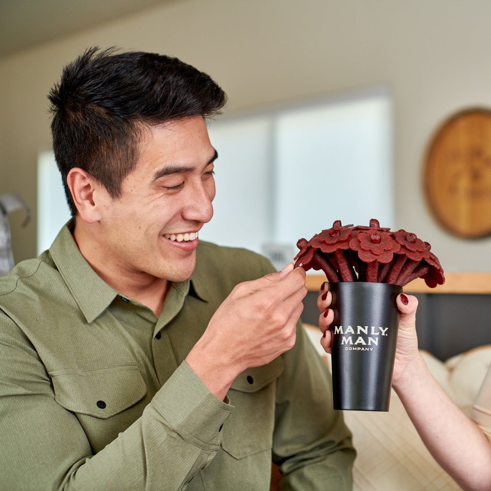 Holiday food gift baskets with jerky bouquets, ammo cans, and bacon gift sets arranged for festive delivery.
