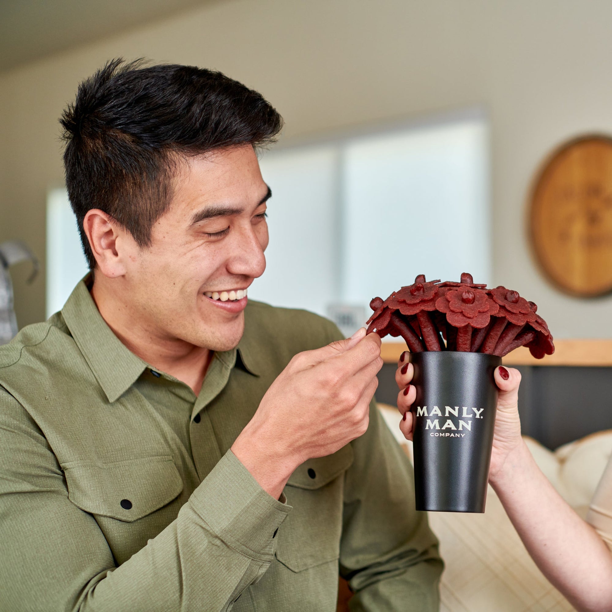 Holiday food gift baskets with jerky bouquets, ammo cans, and bacon gift sets arranged for festive delivery.