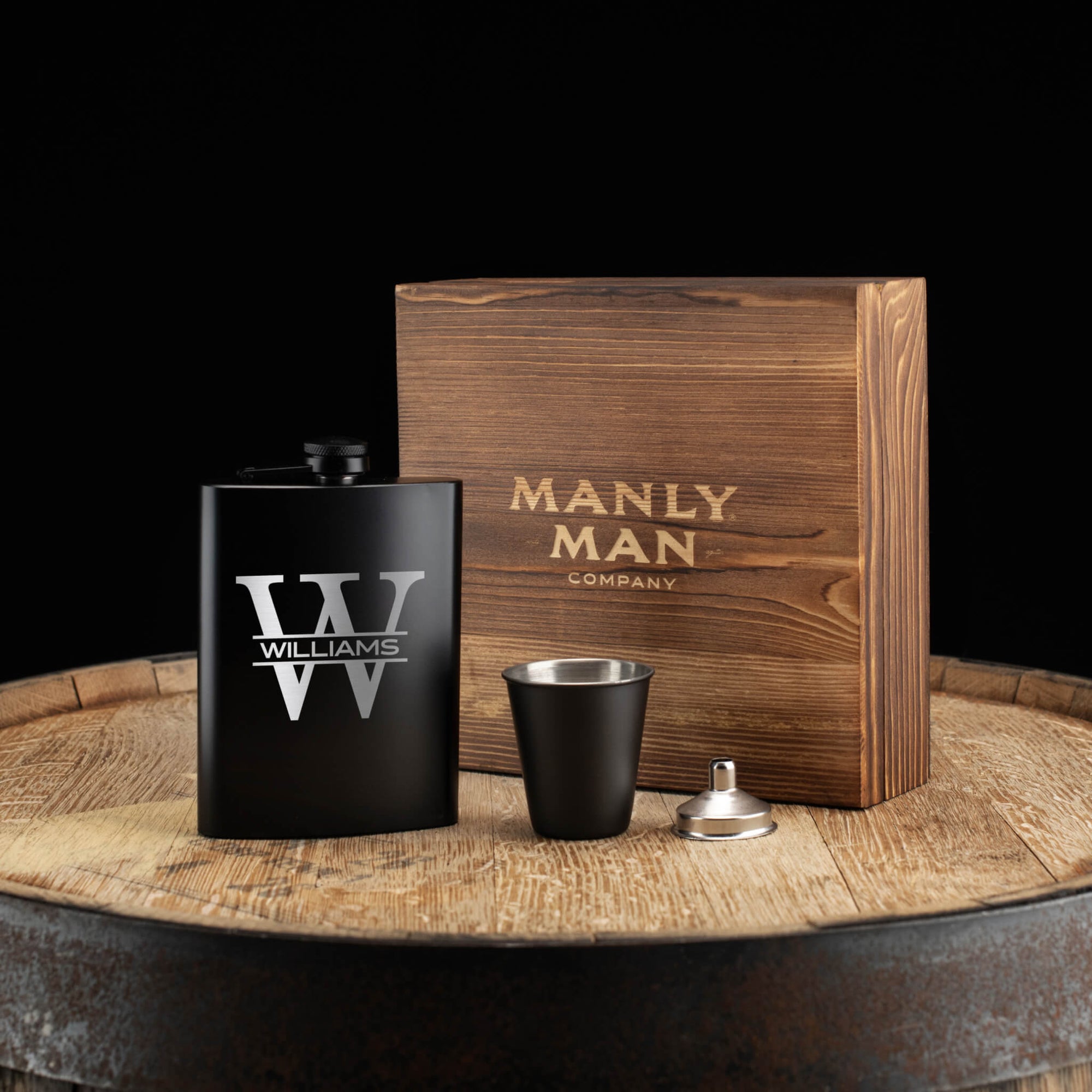 Personalized flask gift set with engraved monogram in rustic wood box – perfect for groomsmen or wedding day toasts.