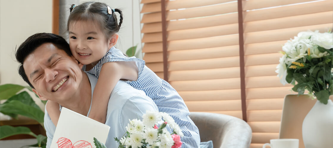 A father with his daughter hugging and having fun on Father's day