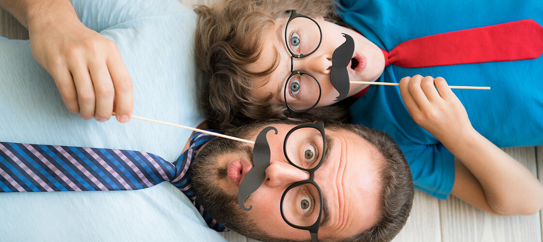 Funny Father’s Day gifts from Manly Man Co. featuring bacon-scented wrapping, meat cards, jerky roses, and humorous snack boxes perfect for dads who love to laugh.