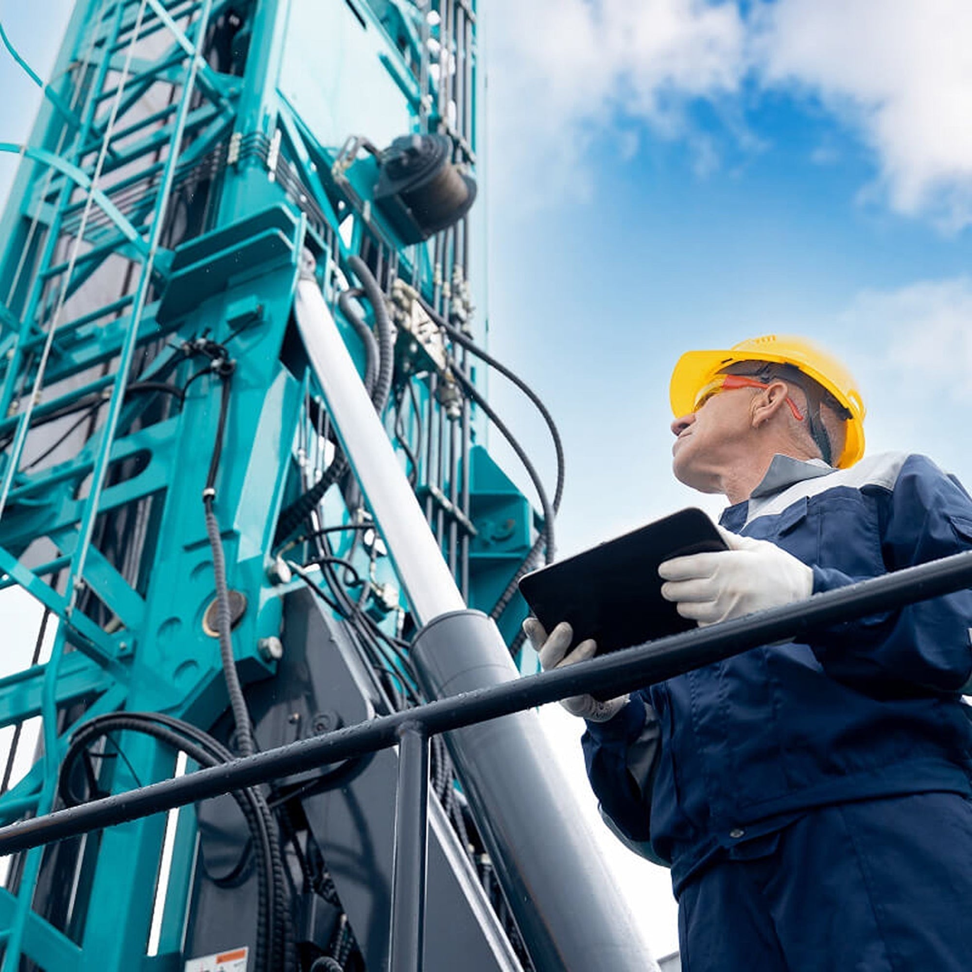 Gifts for engineers who work on-site – field engineer inspecting tower with tablet.