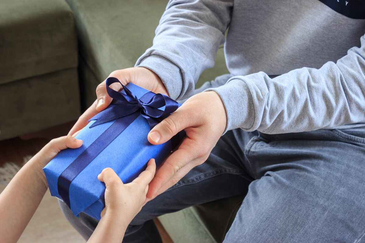 Budget-friendly Christmas gifts for boyfriend featuring jerky snacks, personalized gear, and unique manly treats.