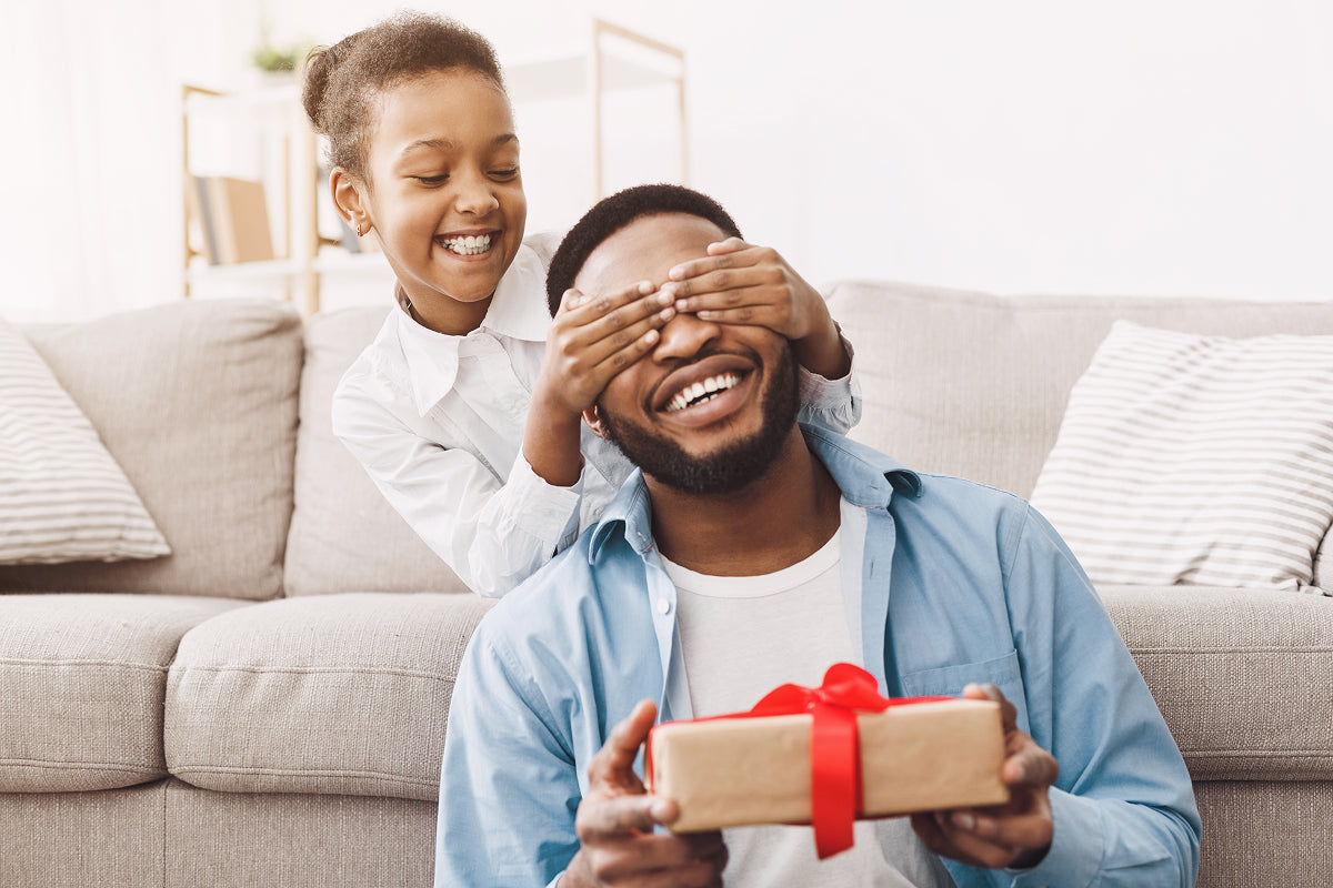 A jerky-loaded gift box, sweet-and-savory meat set, and bacon-scented wrapping paper shown as the ultimate gift basket ideas for dads who snack like kings.