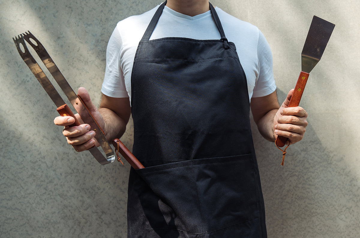 Ammo can loaded with jerky, bacon bouquet, and beer-infused jerky laid out as the best gifts for grill masters ready to fire up their flavor game.