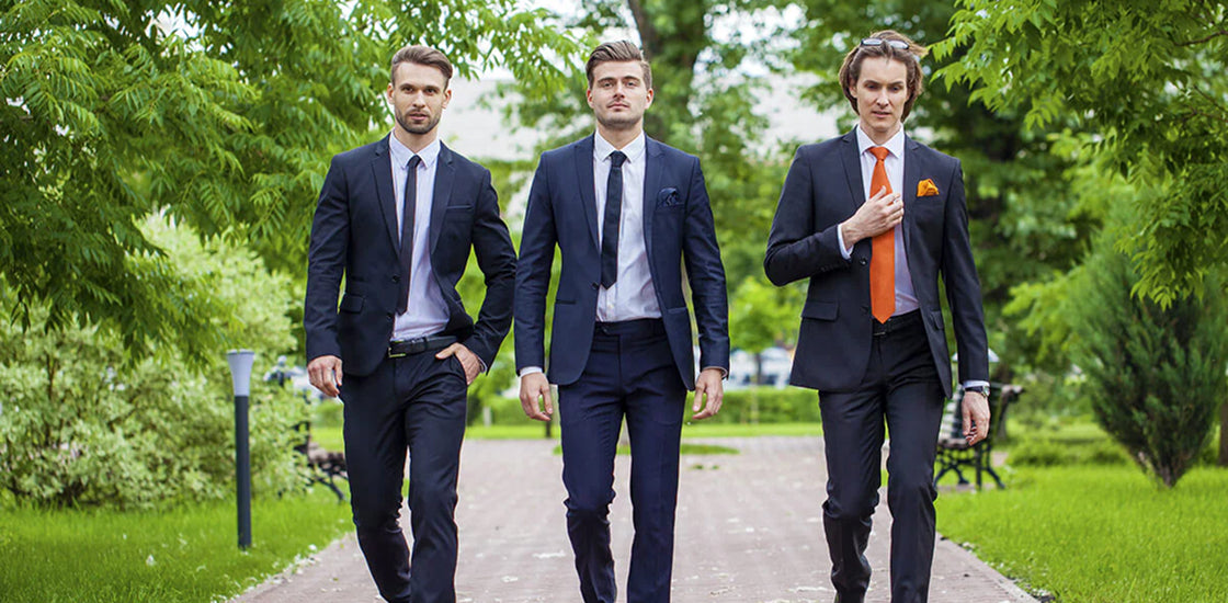 Stylish groomsmen in suits, capturing the vibe for bold, custom gifts that match the moment.