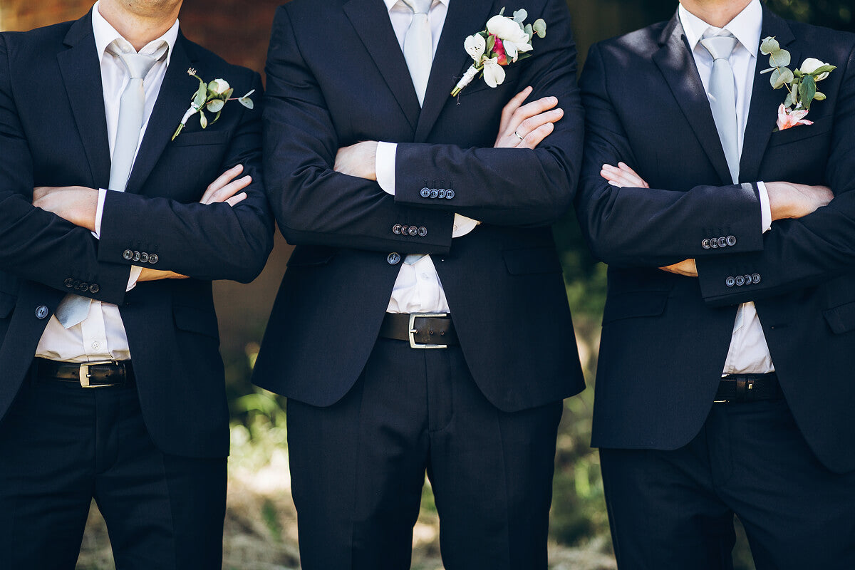 Cool groomsmen gifts including bacon strip bouquets, jerky ammo cans, Bloody Mary kits, and personalized whiskey decanters perfect for wedding day celebrations.
