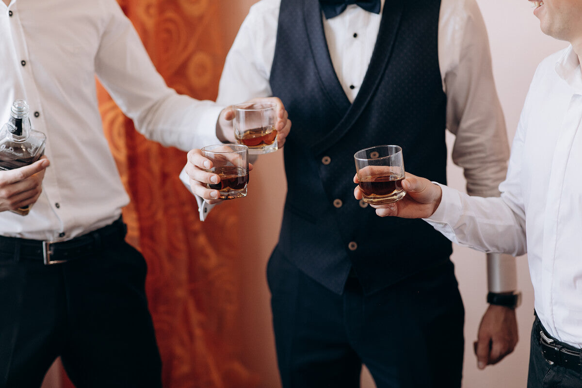 Best man gifts including bacon bouquets, jerky gift boxes, ammo can snack kits, whiskey caramel decanters, and Bloody Mary kits perfect for making your best man feel like a legend.