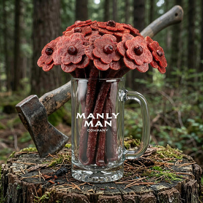 Beef jerky flower and bacon rose man bouquet sitting next to Meat Card and Man Card with hatchet as decoration