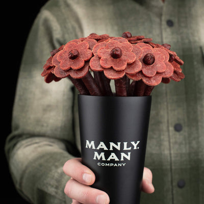 Beef Jerky Rose Bouquet in a special edition black Manly Man stainless steel pint glass.