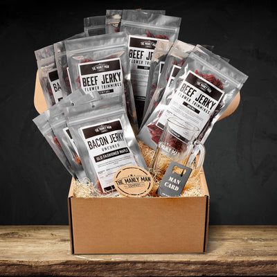 Curated beef jerky gift box on wood table, in front of black background