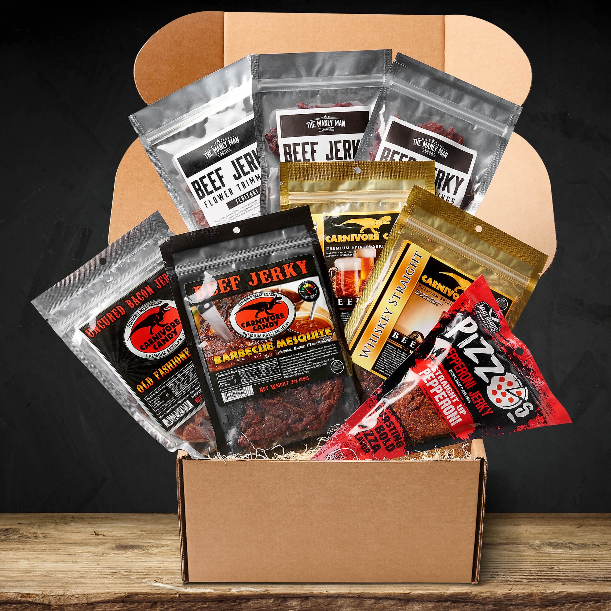 Exotic jerky gift box sitting on wood floor and in front of black background
