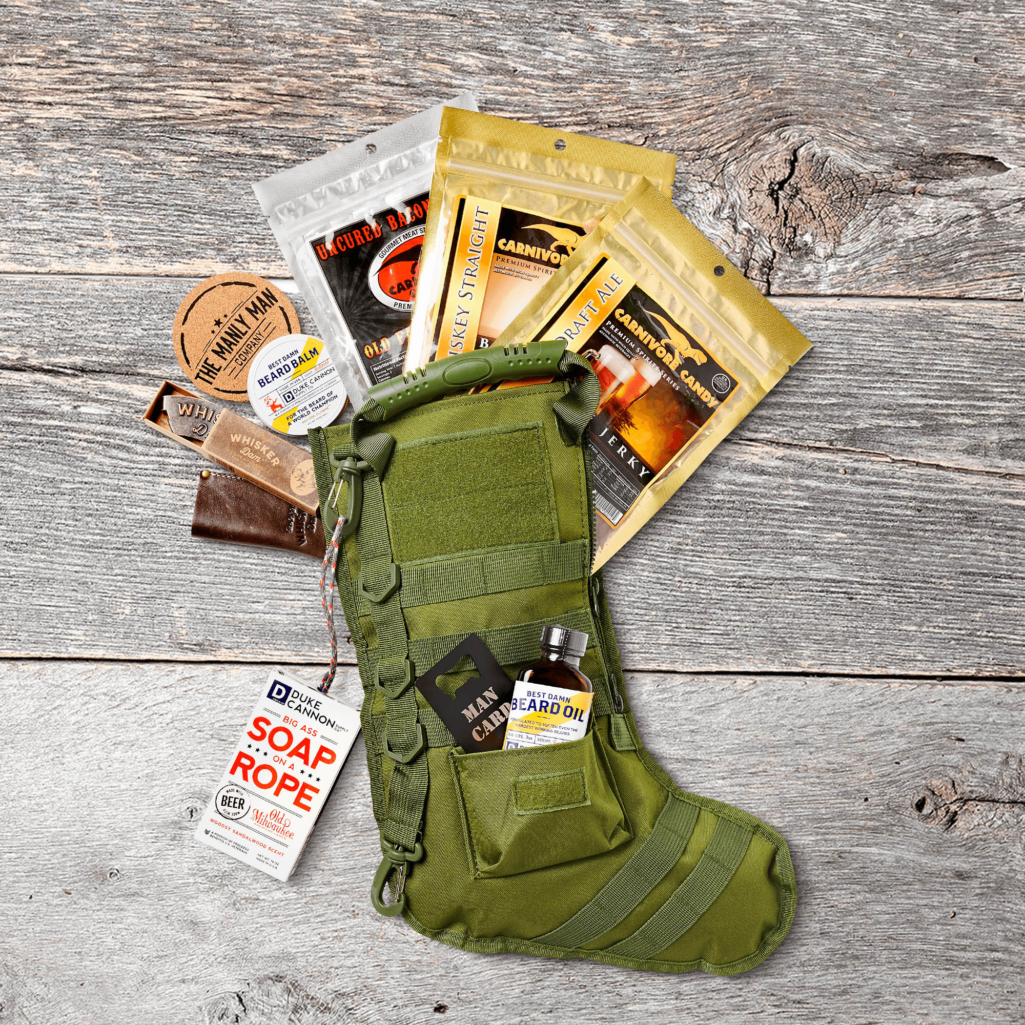 MOLLE X-Mas stocking, filled with bags of jerky, on grey wood background