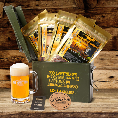 Manly booze-infused jerky gift baskets in front of log cabin-looking background